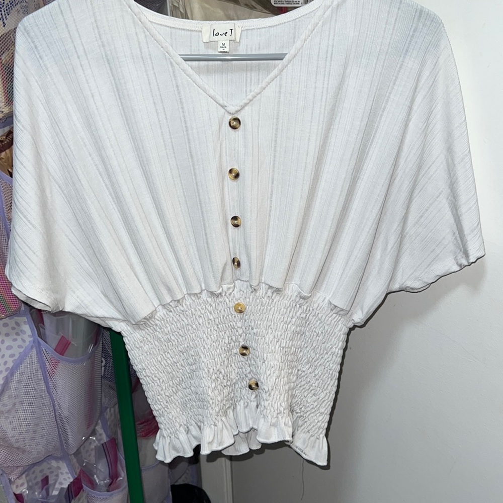 White stretchy dress-up blouse.